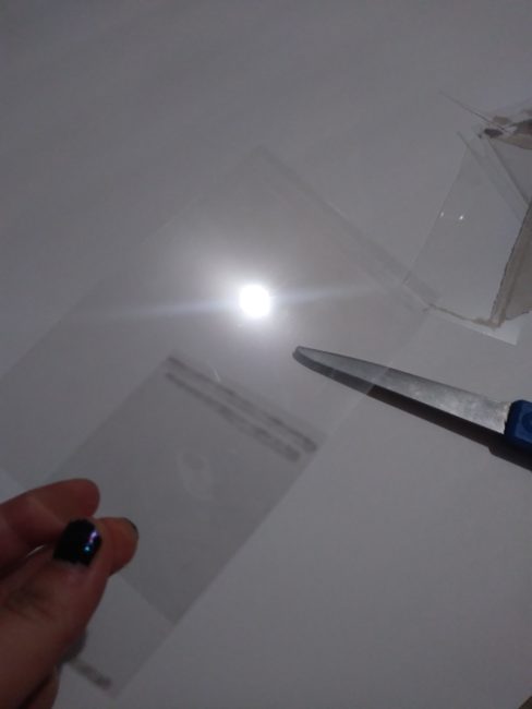 Thin sheet of clear plastic, cut to size
