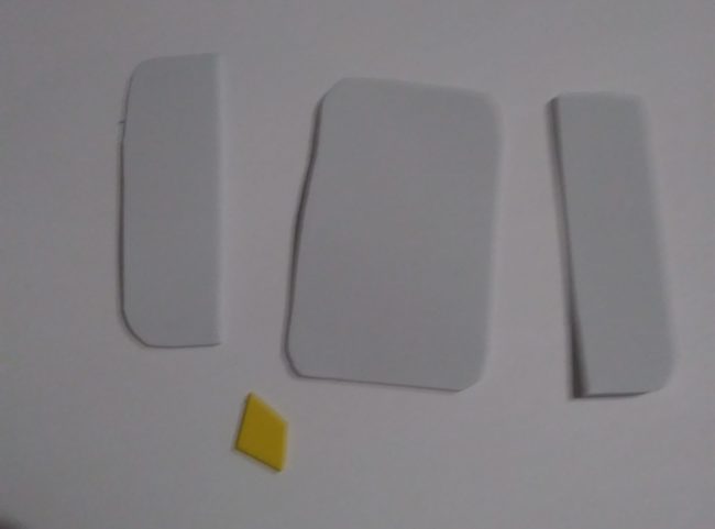 Cut-out pieces of white and yellow foam