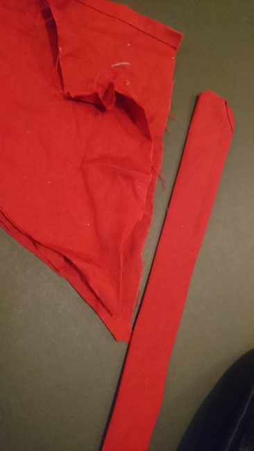 Red fabric plus strip of fabric for project